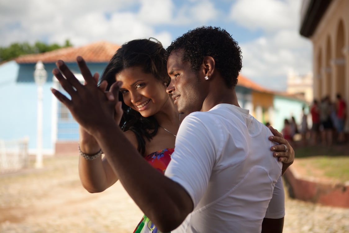 Young black couple dancing salsa